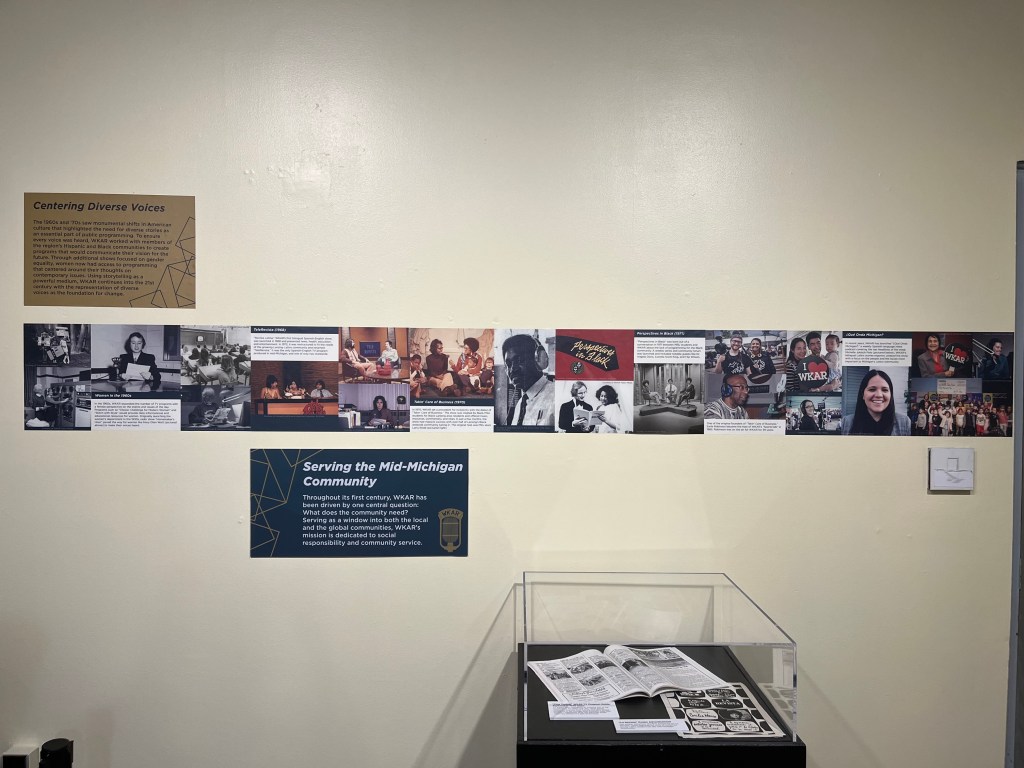 The timeline is pasted onto a wall with a programming guide in a case underneath in.